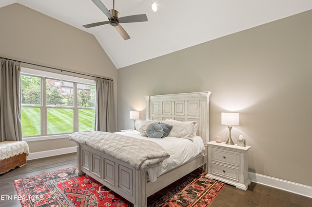 bedroom featuring baseboards, dark wood-style floors, ceiling fan, and lofted ceiling