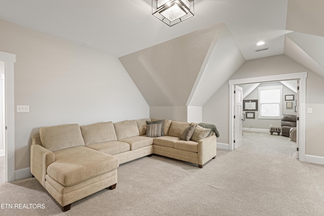 living area with lofted ceiling, visible vents, light carpet, and baseboards