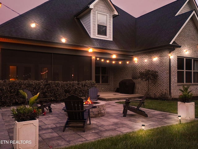 view of patio with a fire pit