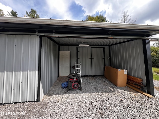 garage featuring a carport