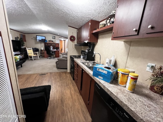 kitchen with a sink, wood finished floors, black appliances, dark brown cabinetry, and open floor plan