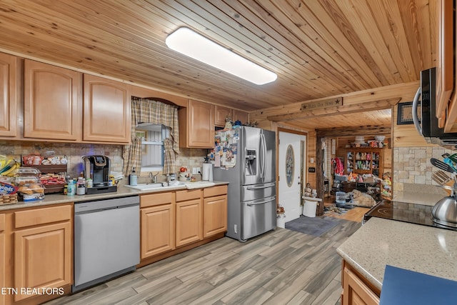 kitchen featuring tasteful backsplash, wood ceiling, stainless steel appliances, light wood finished floors, and a sink