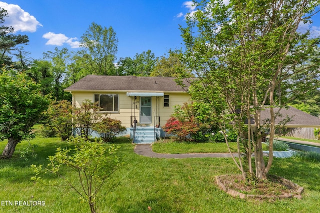 view of front of home with a front yard