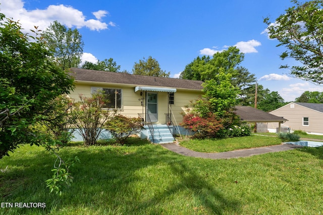 ranch-style home with a front yard