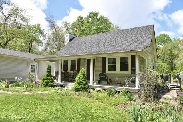 220 Lovelady Ln, Dayton, TN 37321 - back of house with a shingled roof, covered porch, and a chimney