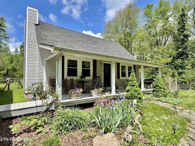 220 Lovelady Ln, Dayton, TN 37321 - view of front facade featuring a porch, a shingled roof, and a chimney