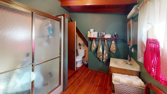 220 Lovelady Ln, Dayton, TN 37321 - bathroom featuring vanity, a stall shower, toilet, and hardwood / wood-style flooring