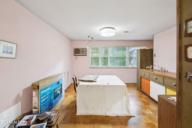 interior space with visible vents and a wall unit AC