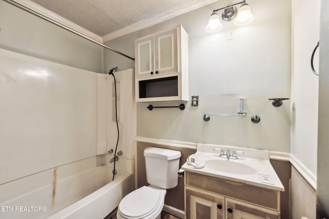 bathroom featuring a textured ceiling, vanity, toilet,  shower combination, and ornamental molding