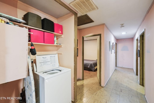 laundry room with visible vents, laundry area, washer / clothes dryer, and tile patterned floors