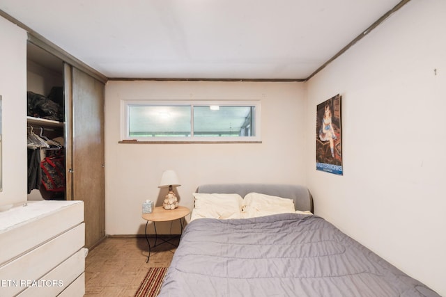 bedroom with a closet and wood finished floors