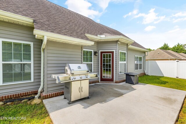 view of patio featuring fence and area for grilling