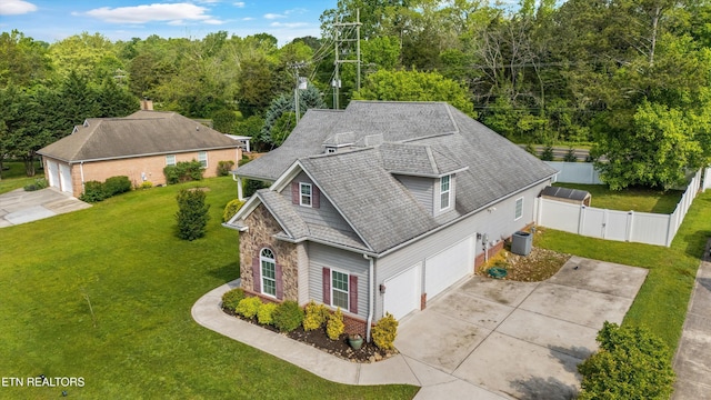 birds eye view of property with a forest view