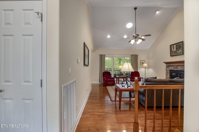 160 Kawga Way, Loudon, TN 37774 - living area with ceiling fan, a fireplace, lofted ceiling, visible vents, and ornamental molding