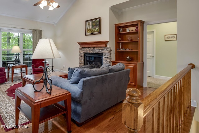 160 Kawga Way, Loudon, TN 37774 - living room with crown molding, ceiling fan, a stone fireplace, baseboards, and lofted ceiling