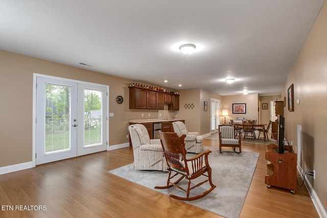 160 Kawga Way, Loudon, TN 37774 - living area featuring baseboards, light wood-style flooring, french doors, and wet bar