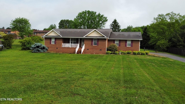 ranch-style house with a front lawn, crawl space, covered porch, and brick siding