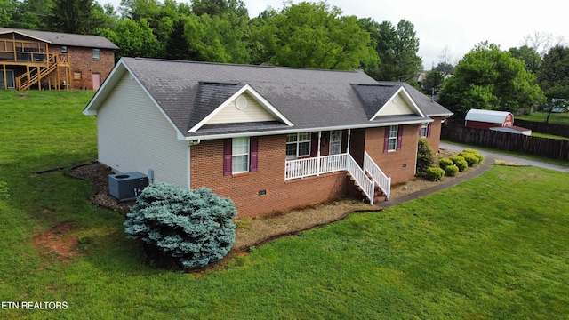 view of front of home featuring a front yard, crawl space, stairway, and brick siding