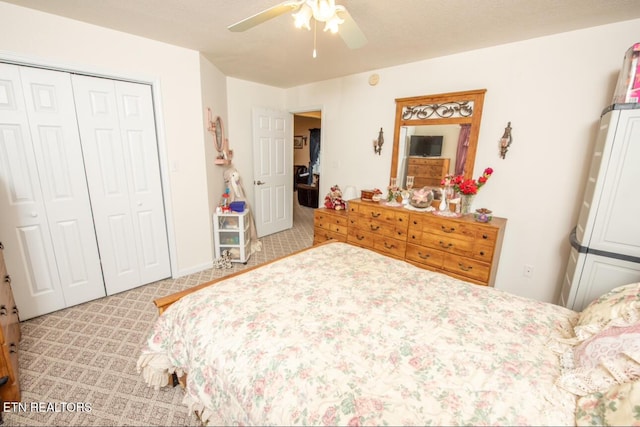 bedroom featuring a closet, ceiling fan, and carpet floors