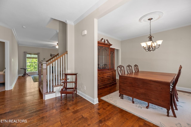 dining area with crown molding, baseboards, stairway, and hardwood / wood-style floors