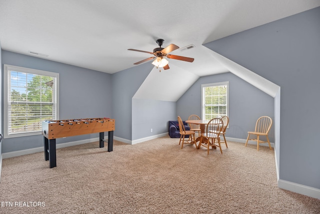 rec room featuring carpet floors, a ceiling fan, and visible vents