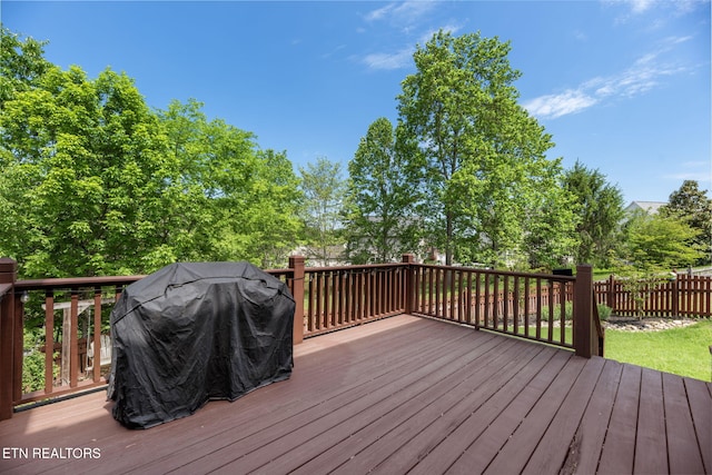deck with grilling area and fence