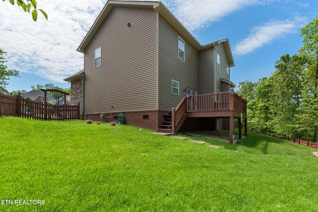 back of house featuring fence, a wooden deck, stairway, crawl space, and a yard