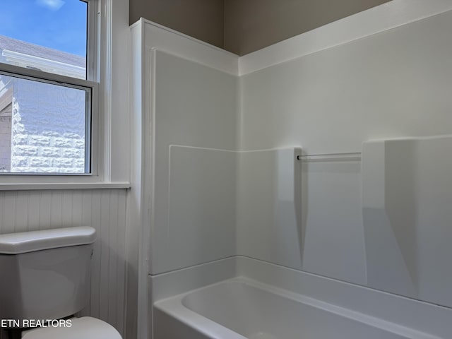full bathroom with toilet and bathtub / shower combination