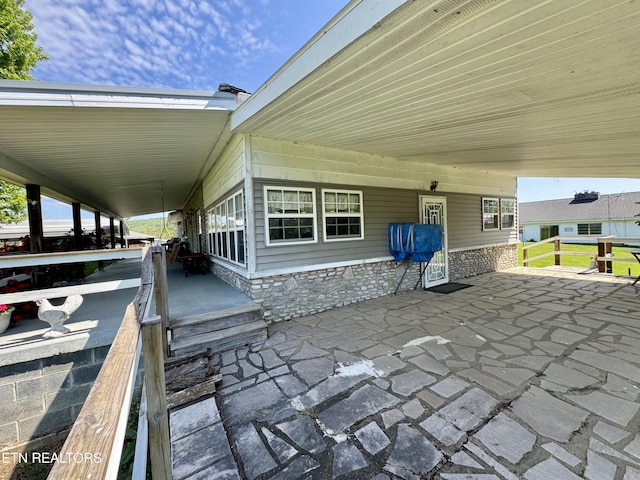 view of patio featuring a carport