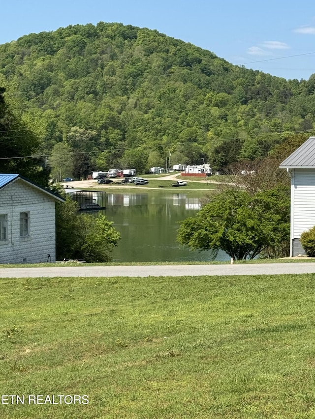 property view of water with a view of trees