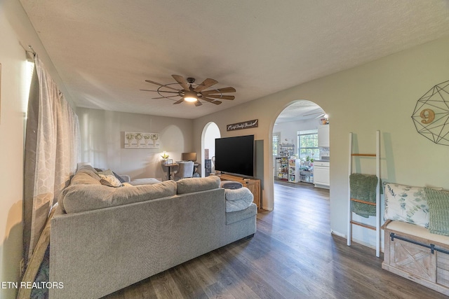 352 St Edward Dr, Dandridge, TN 37725 - living area featuring arched walkways, ceiling fan, and dark wood-type flooring