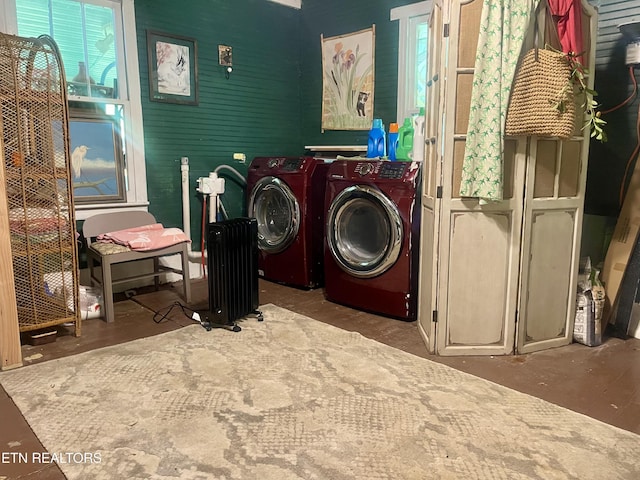 laundry room with washing machine and clothes dryer
