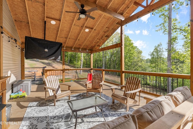 wooden deck featuring an outdoor hangout area and ceiling fan