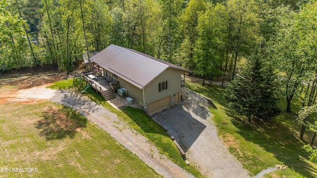 birds eye view of property with a wooded view