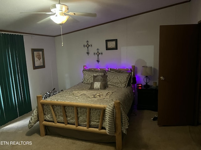 bedroom featuring ornamental molding, a ceiling fan, vaulted ceiling, and carpet