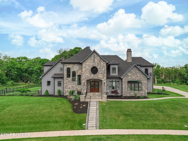 367 Barnsley Rd, Farragut, TN 37934 - french provincial home featuring a front yard, fence, stone siding, and a chimney