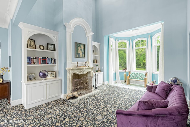 367 Barnsley Rd, Farragut, TN 37934 - carpeted living area with a high ceiling, built in features, and baseboards