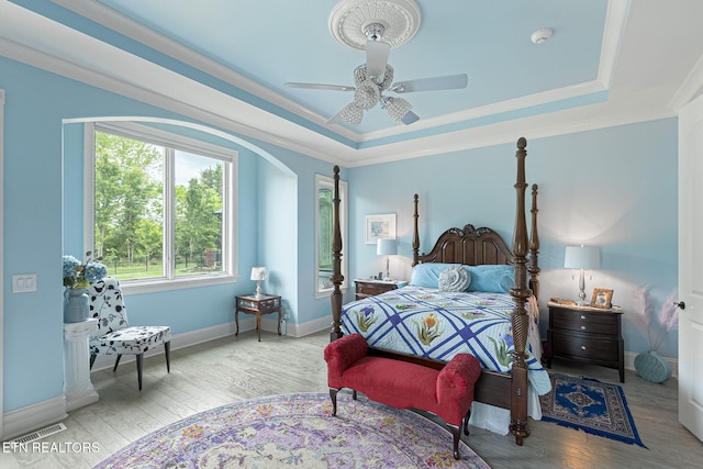 367 Barnsley Rd, Farragut, TN 37934 - bedroom featuring baseboards, a raised ceiling, wood finished floors, and crown molding