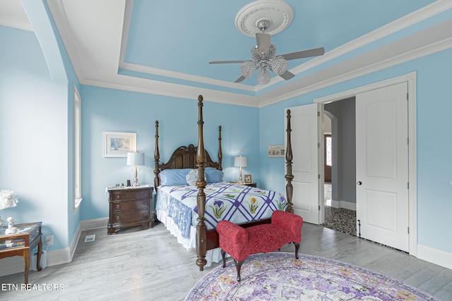 367 Barnsley Rd, Farragut, TN 37934 - bedroom featuring wood finished floors, ornamental molding, baseboards, a raised ceiling, and a ceiling fan