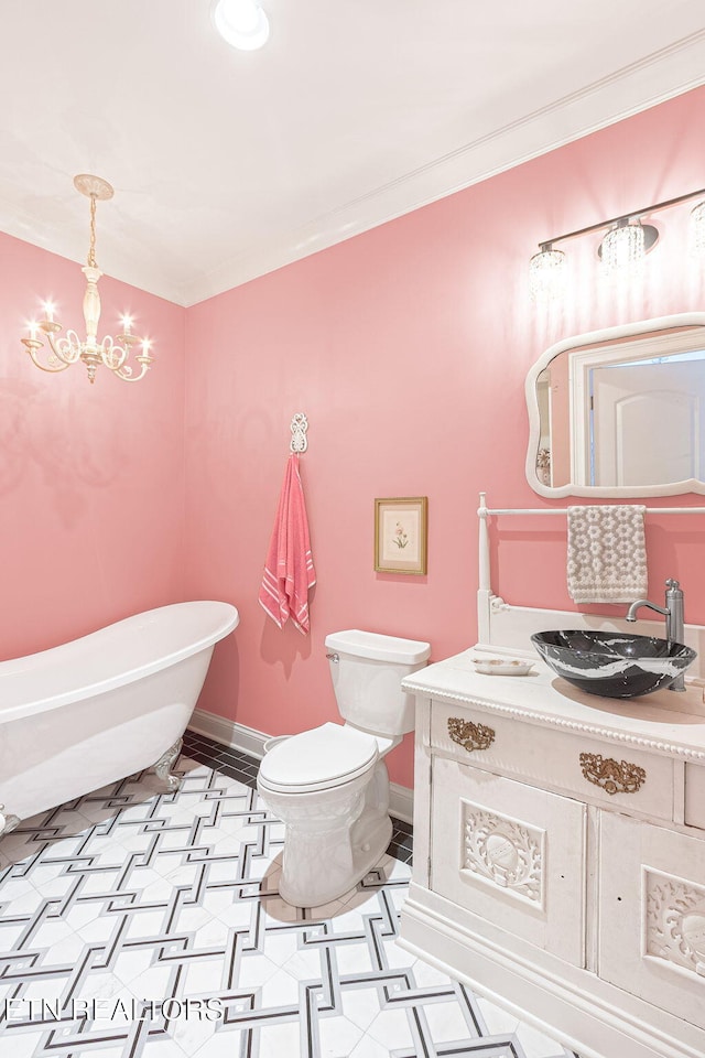 367 Barnsley Rd, Farragut, TN 37934 - full bath with baseboards, an inviting chandelier, toilet, vanity, and a freestanding bath
