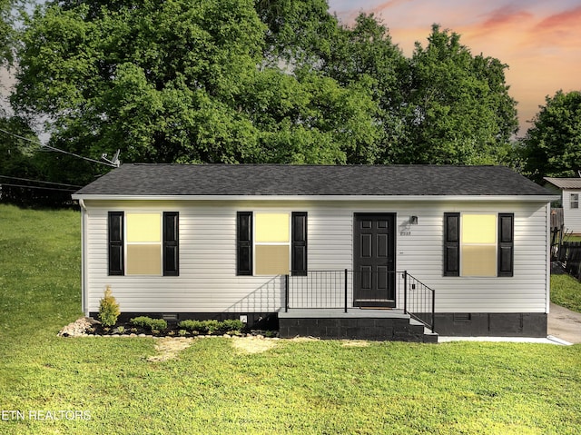 manufactured / mobile home featuring crawl space, a front yard, and roof with shingles