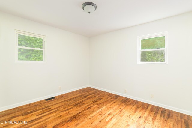 218 Jerry Ln, Knoxville, TN 37920 - empty room featuring healthy amount of natural light, baseboards, and wood finished floors