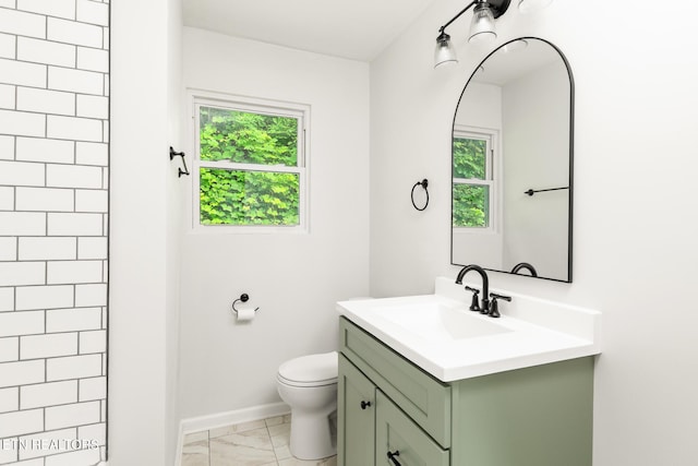 218 Jerry Ln, Knoxville, TN 37920 - full bath featuring vanity, marble finish floors, toilet, baseboards, and a tile shower