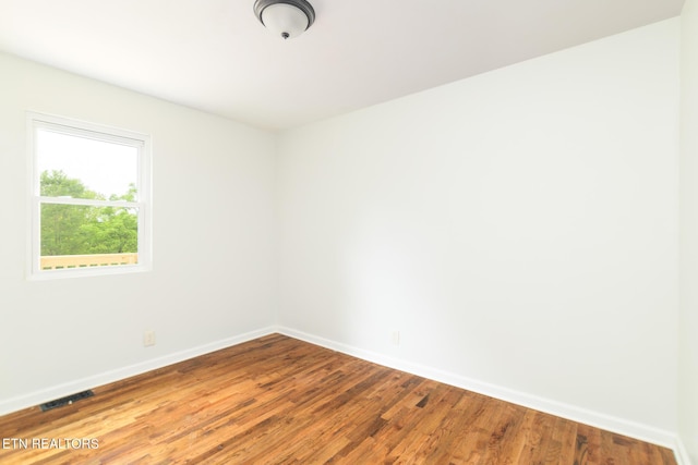 218 Jerry Ln, Knoxville, TN 37920 - spare room featuring baseboards and wood finished floors