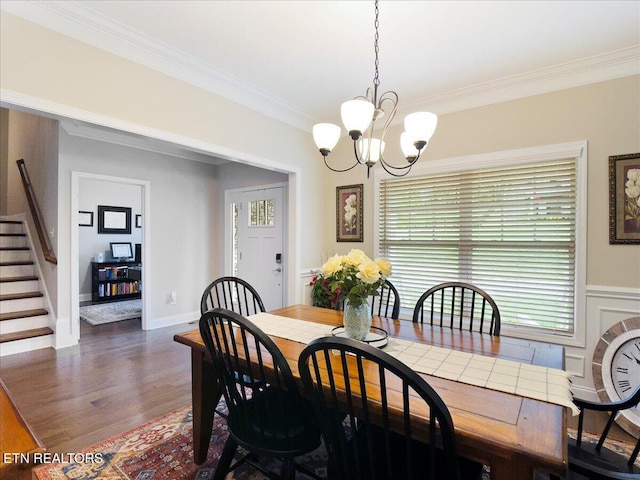 107 Mistletoeberry Rd, Oak Ridge, TN 37830 - dining space featuring an inviting chandelier, stairway, wood finished floors, and crown molding