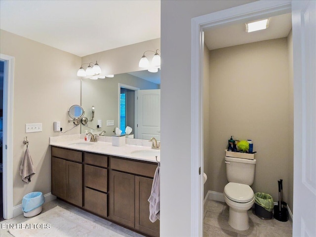 107 Mistletoeberry Rd, Oak Ridge, TN 37830 - bathroom featuring double vanity, toilet, tile patterned flooring, and a sink