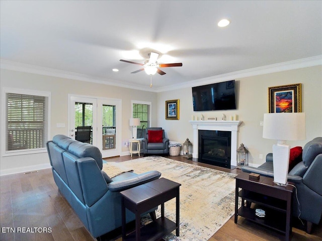 107 Mistletoeberry Rd, Oak Ridge, TN 37830 - living area featuring wood finished floors, ornamental molding, ceiling fan, baseboards, and a fireplace with flush hearth