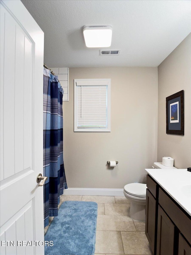 107 Mistletoeberry Rd, Oak Ridge, TN 37830 - full bath with vanity, tile patterned floors, toilet, visible vents, and baseboards