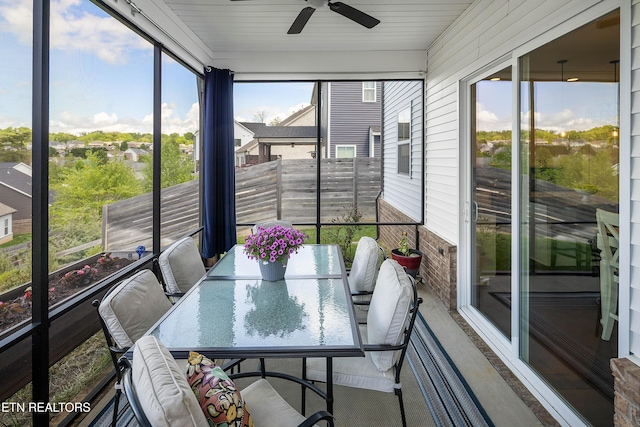 sunroom with a ceiling fan