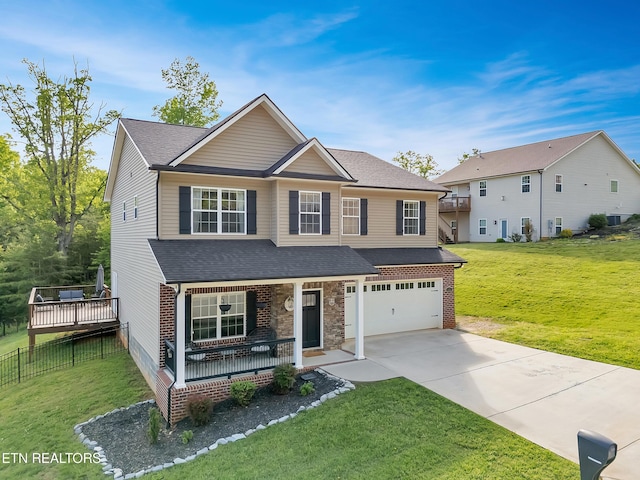 view of front of house with a garage, a front lawn, roof with shingles, a porch, and driveway
